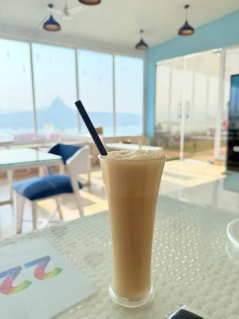 Cold coffee served against the Pawna Lake view