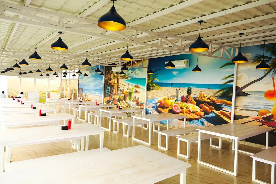 Mural-decorated interior dining area at The Oven Lakeside