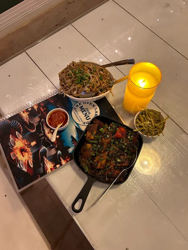 Sizzling platter served with a candle for evening dining in Pawna
