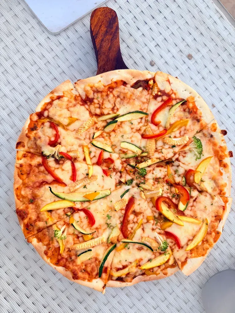 Fresh wood-fired pizza served at The Oven Lakeside restaurant in Pawna